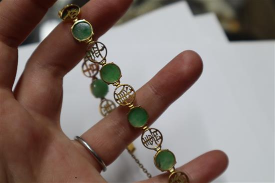 A Chinese 14k yellow metal, character link and cabochon jadeite set bracelet, gross 12.4 grams.